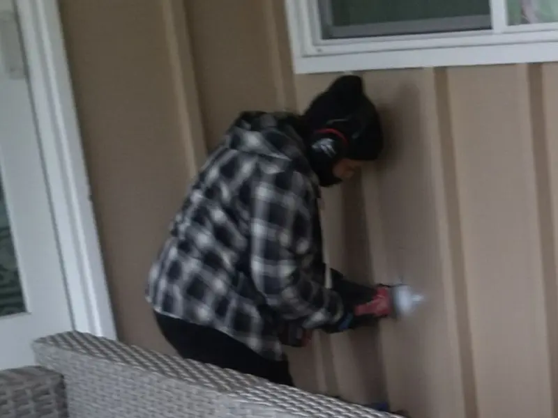 Professional electrician installing an exterior outlet in Hometown